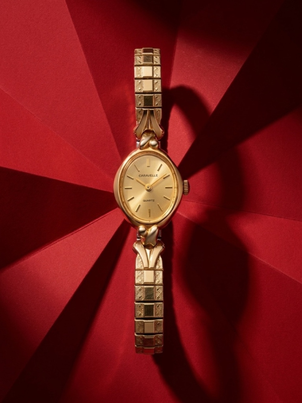 Vintage   Caravelle by Bulova Ladies Quartz Watch - Gold Tone with Speidel bang